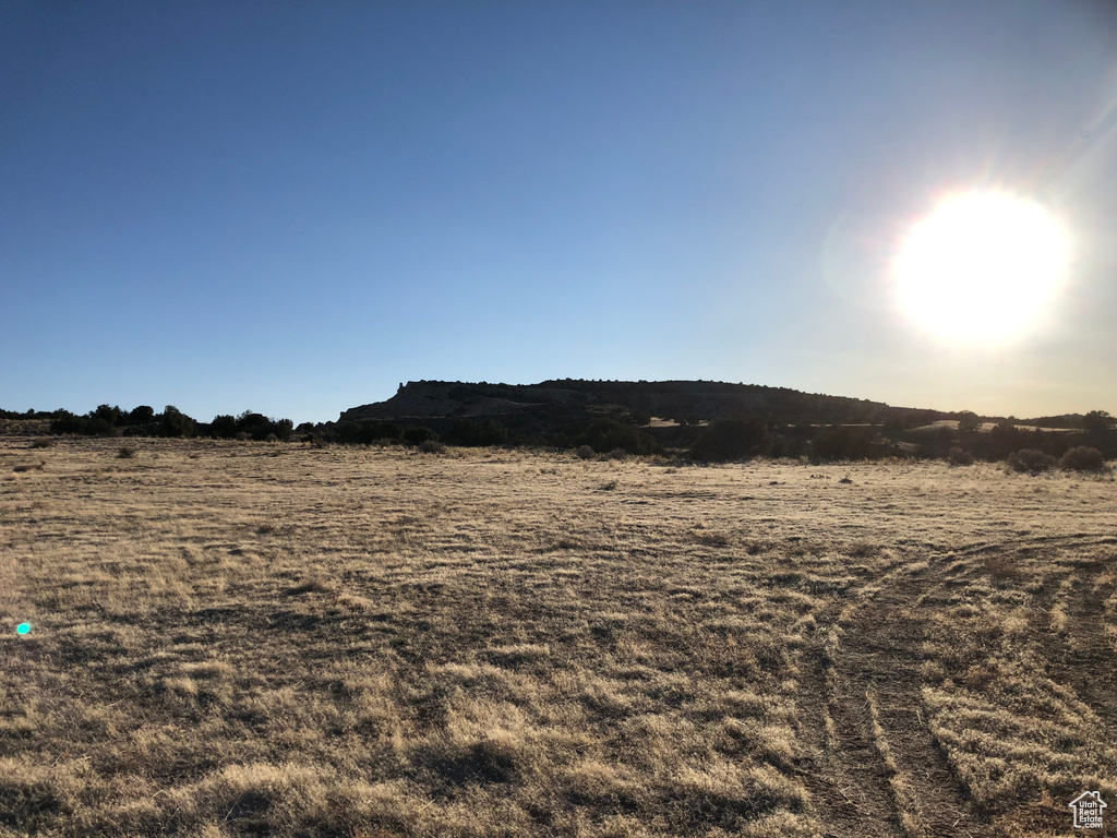 View of yard with a rural view