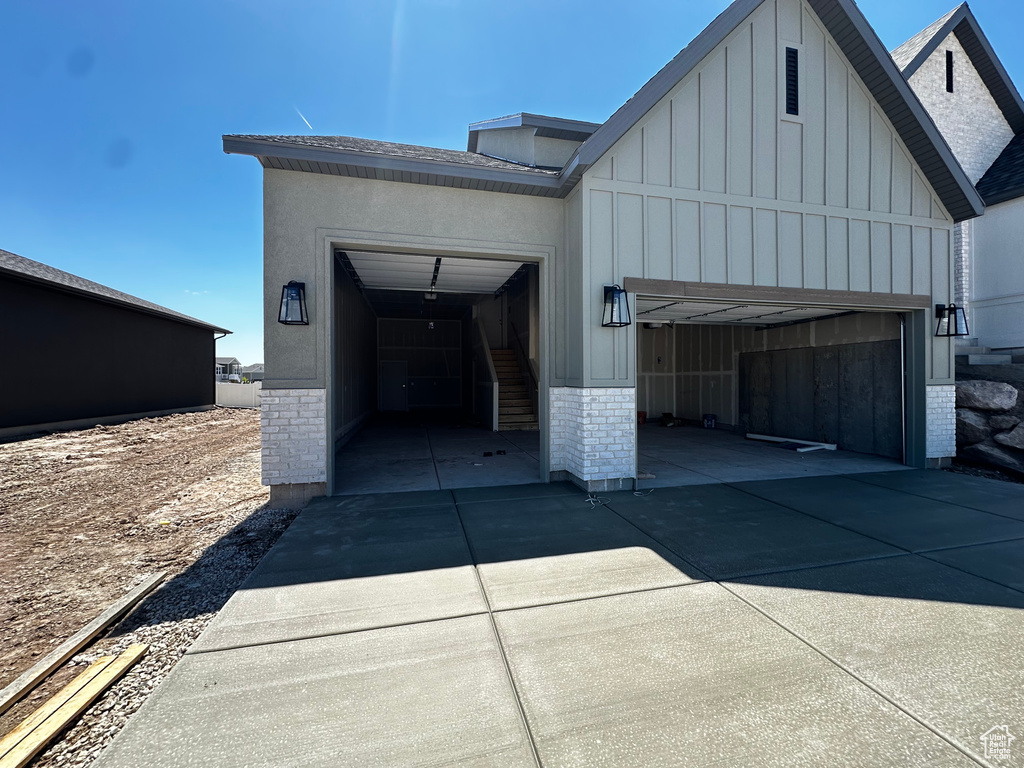 Garage with concrete driveway