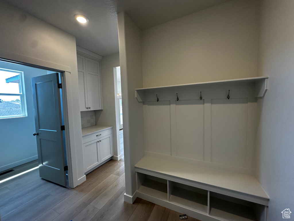Mudroom featuring baseboards, dark wood-style flooring, and recessed lighting