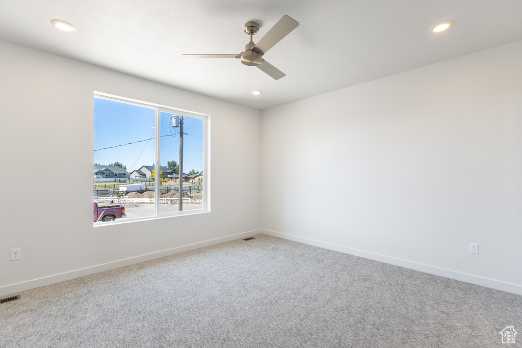 Empty room with ceiling fan, carpet floors, baseboards, and recessed lighting