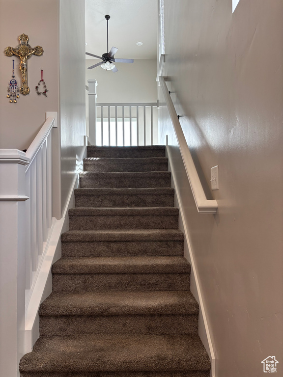 Stairway with a ceiling fan