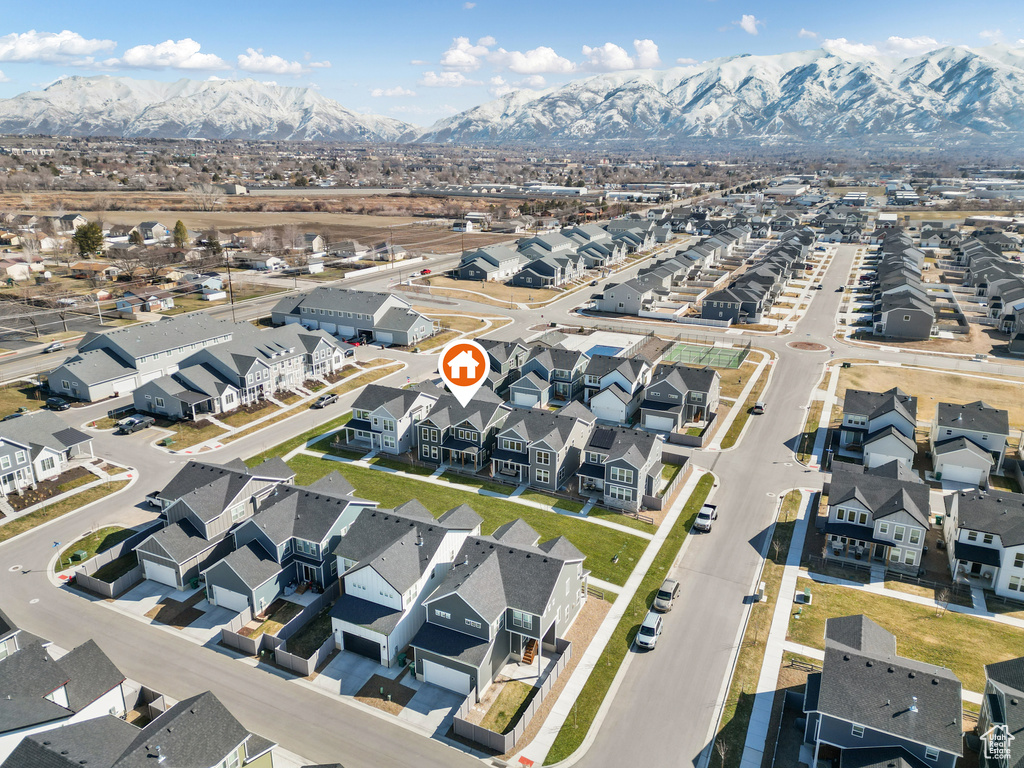 Aerial perspective of suburban area with a mountainous background