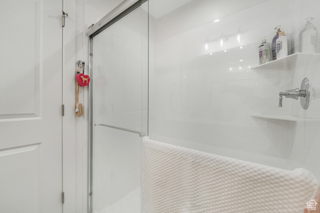 Full bathroom with a shower stall