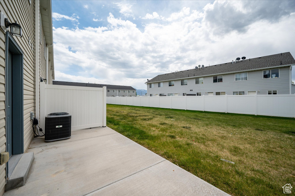 View of yard featuring a patio and central AC