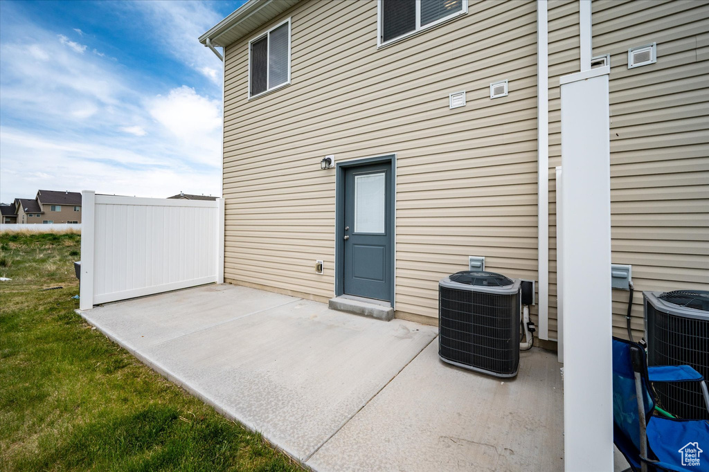 View of patio featuring cooling unit