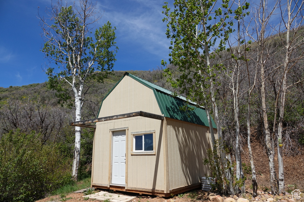 View of shed featuring a forest view