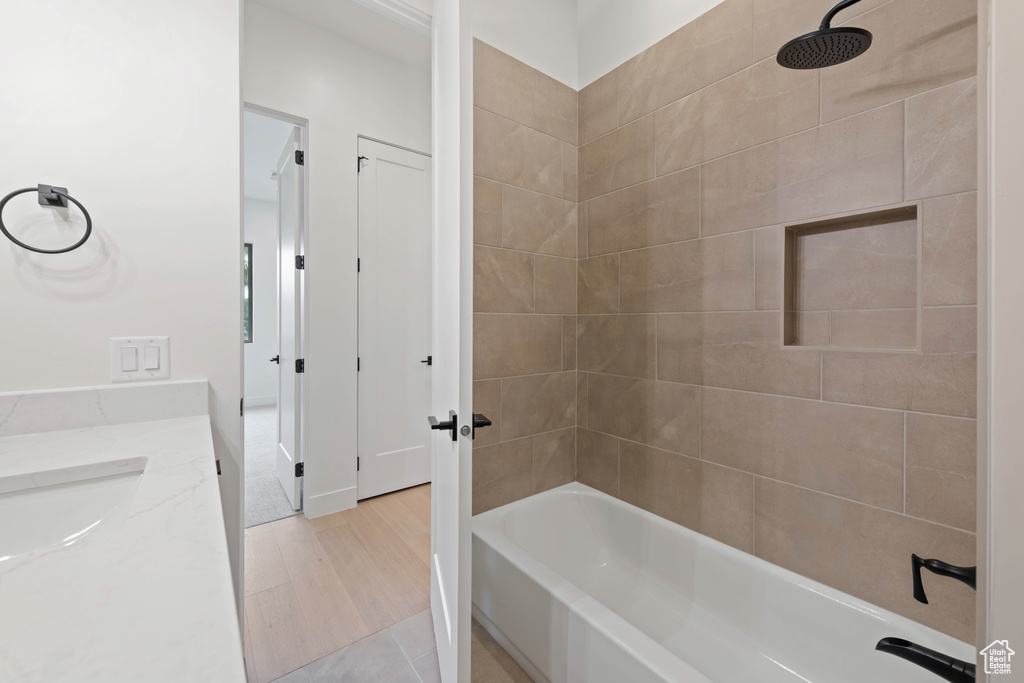 Full bath featuring washtub / shower combination