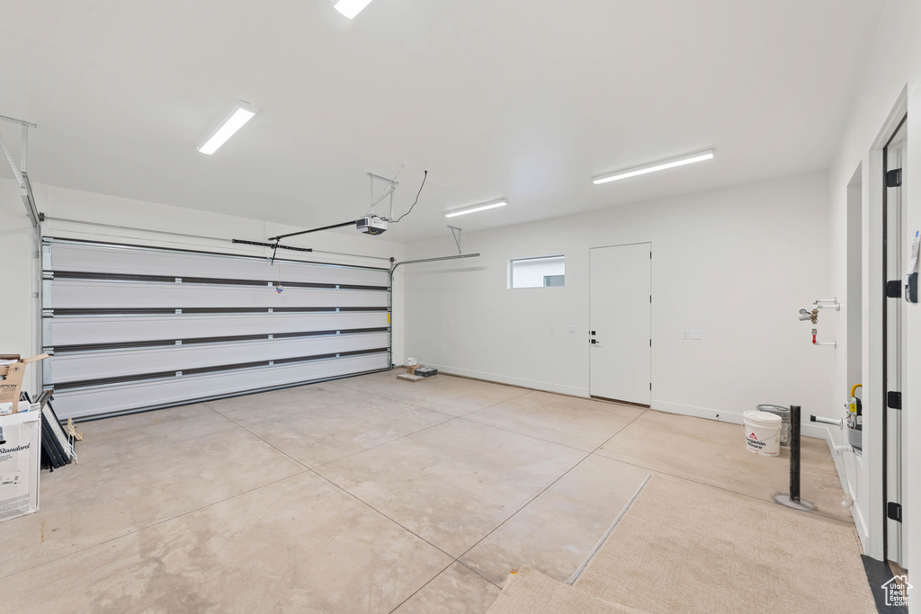Garage featuring a garage door opener