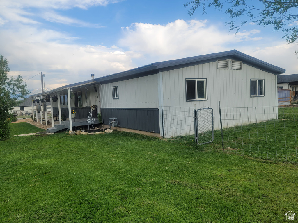 Back of property with a yard