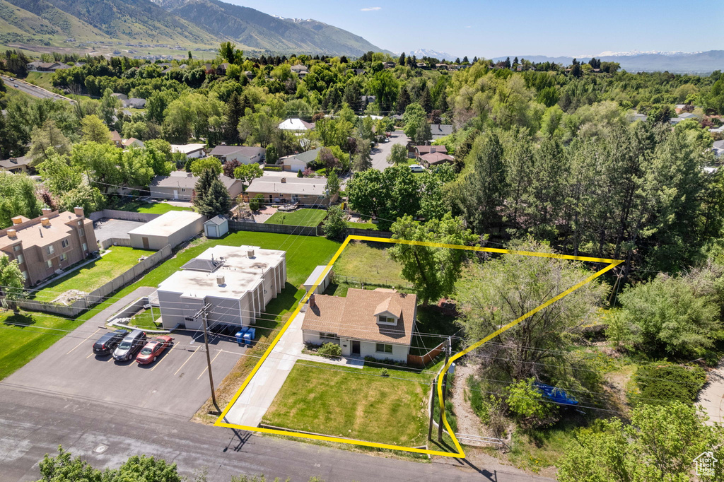 Aerial view of property\'s location featuring property parcel outlined and a mountain backdrop