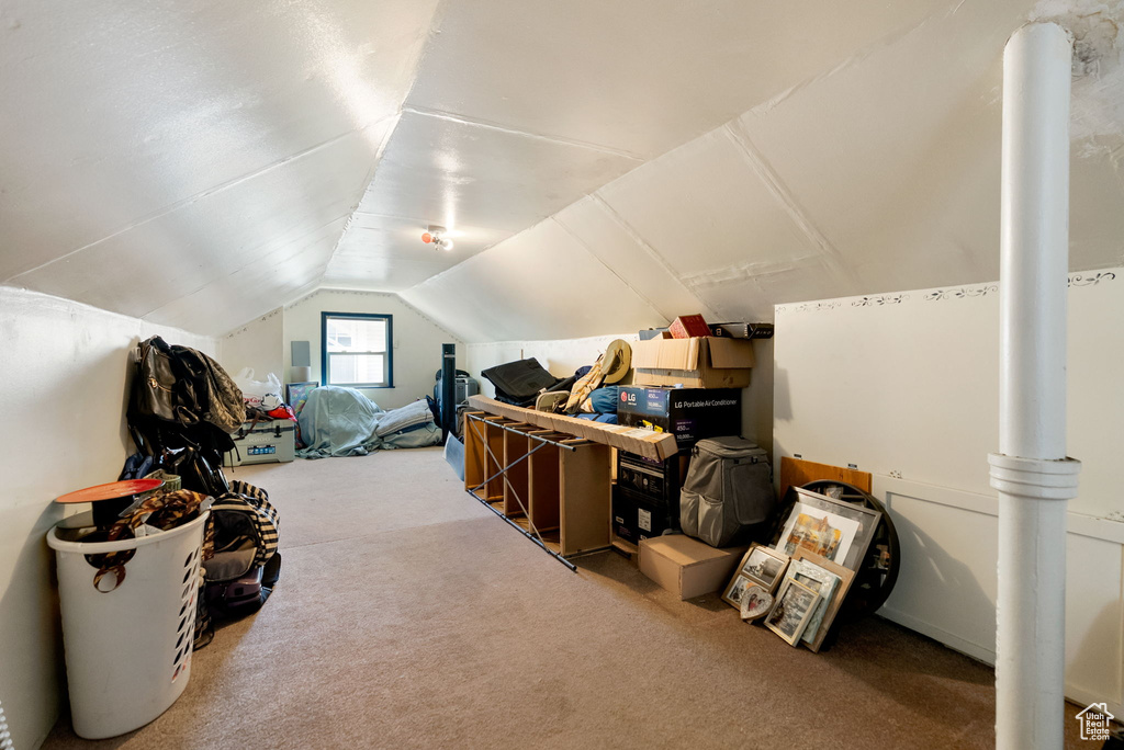 Bonus room featuring carpet floors and vaulted ceiling