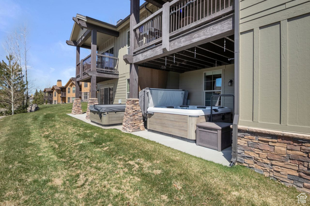 Exterior space featuring a hot tub