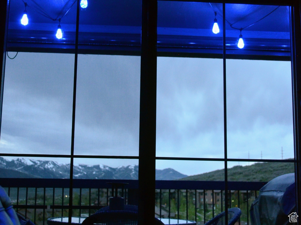 Sunroom / solarium with a mountain view
