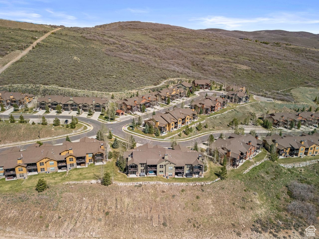 Birds eye view of property with a mountain view and a residential view
