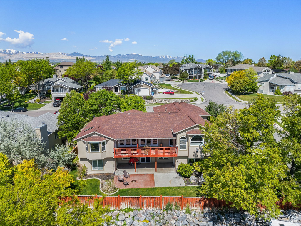 Aerial perspective of suburban area with a mountain backdrop