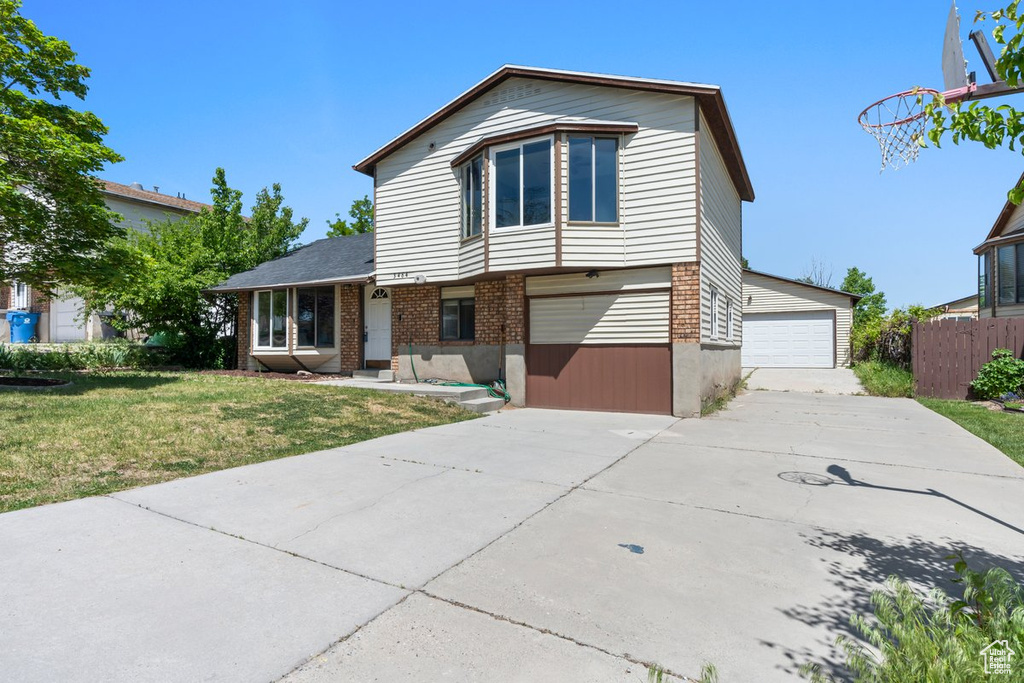 Split level home featuring brick siding