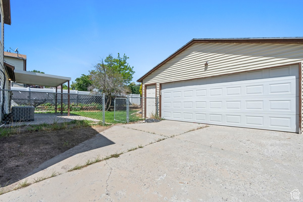 Garage with fence and a gate