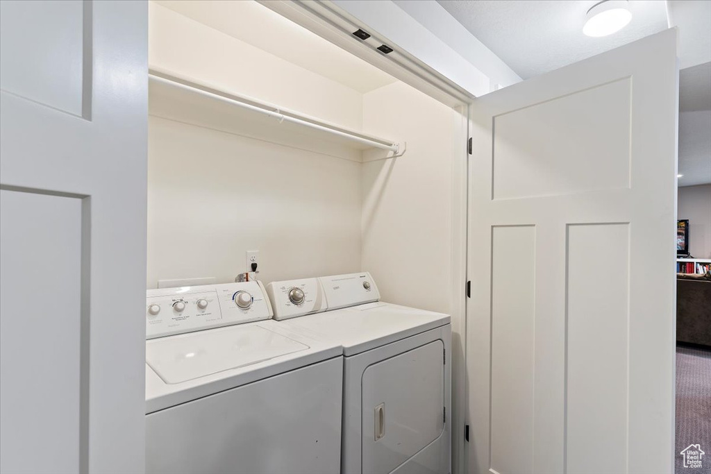 Washroom featuring washing machine and dryer