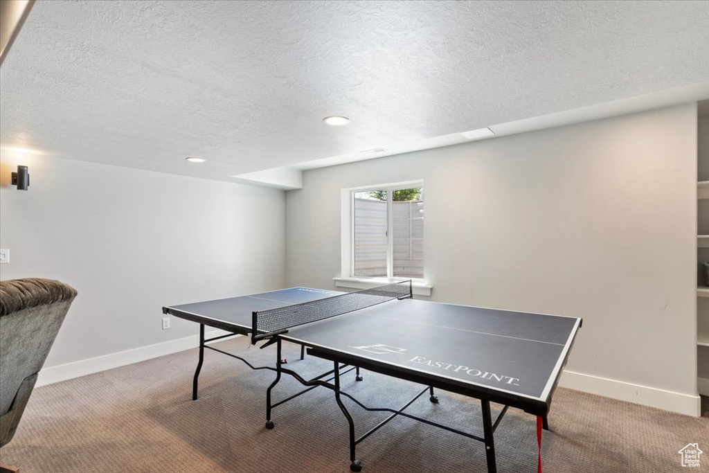 Playroom with a textured ceiling, carpet floors, baseboards, and recessed lighting