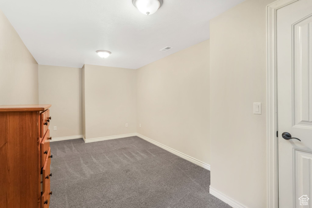 Below grade area with carpet floors and baseboards