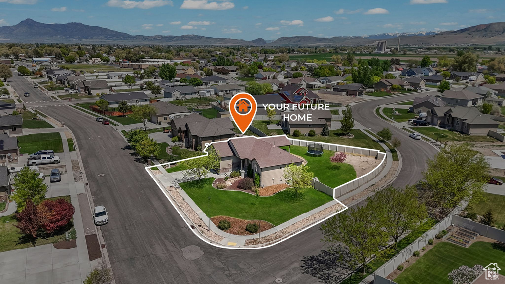 Aerial perspective of suburban area with a mountain backdrop