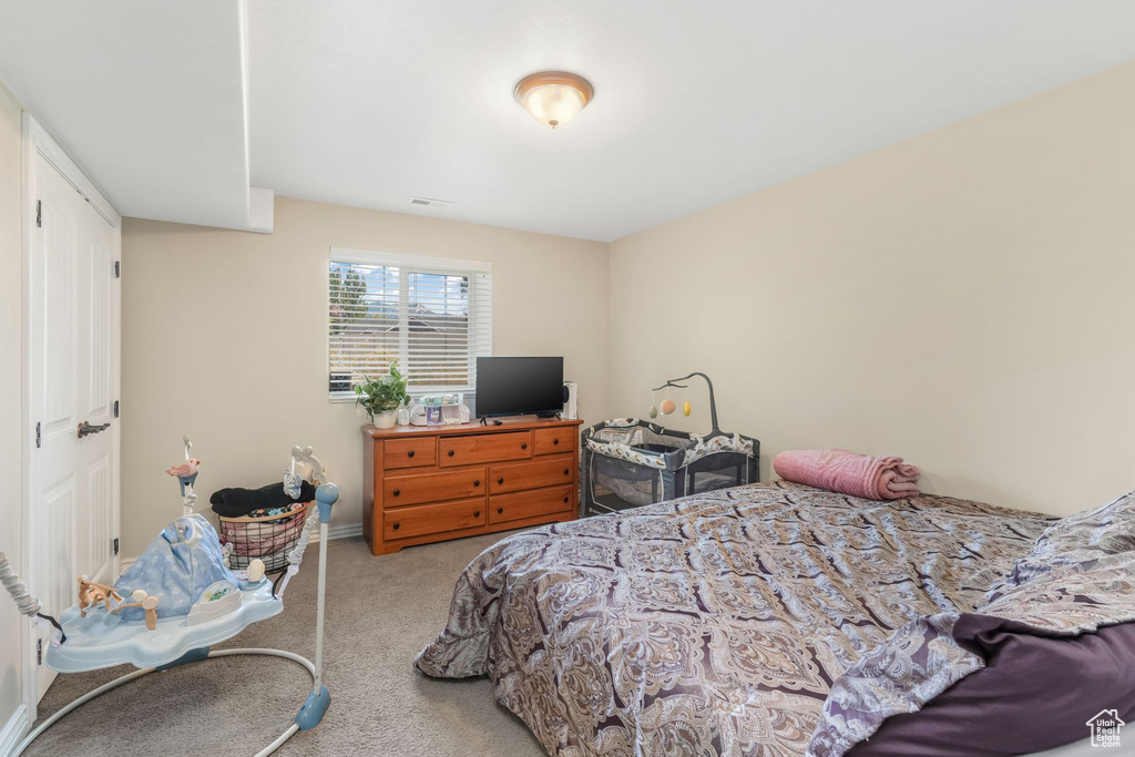 Carpeted bedroom with baseboards