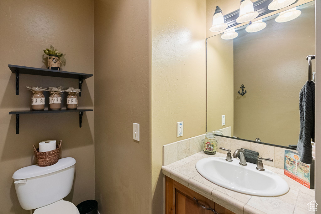 Bathroom featuring toilet and vanity