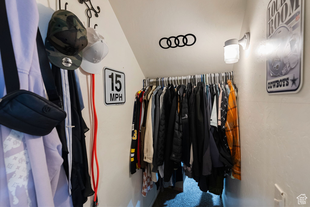 Spacious closet with vaulted ceiling