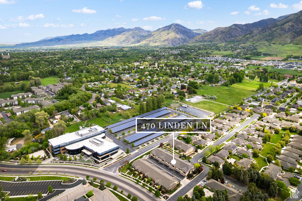 View of property location with a mountainous background and nearby suburban area