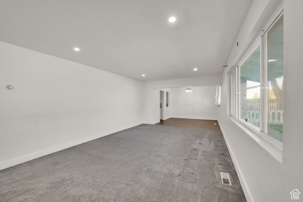 Unfurnished room with recessed lighting, carpet, and baseboards