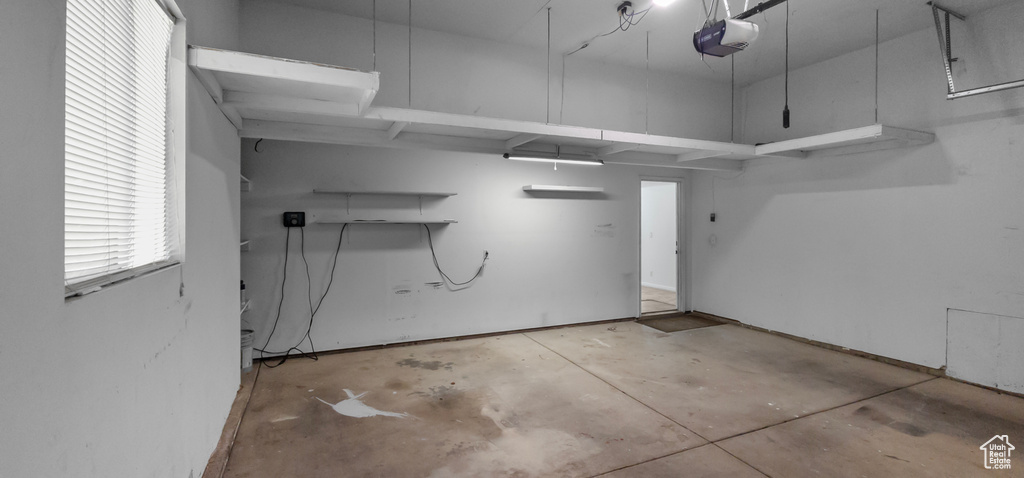 Garage featuring a garage door opener