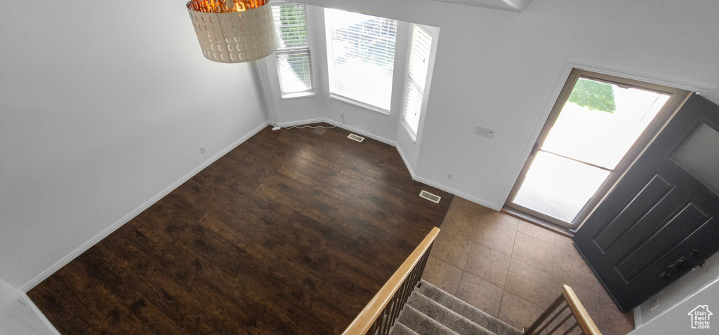 Entryway with baseboards and wood finished floors