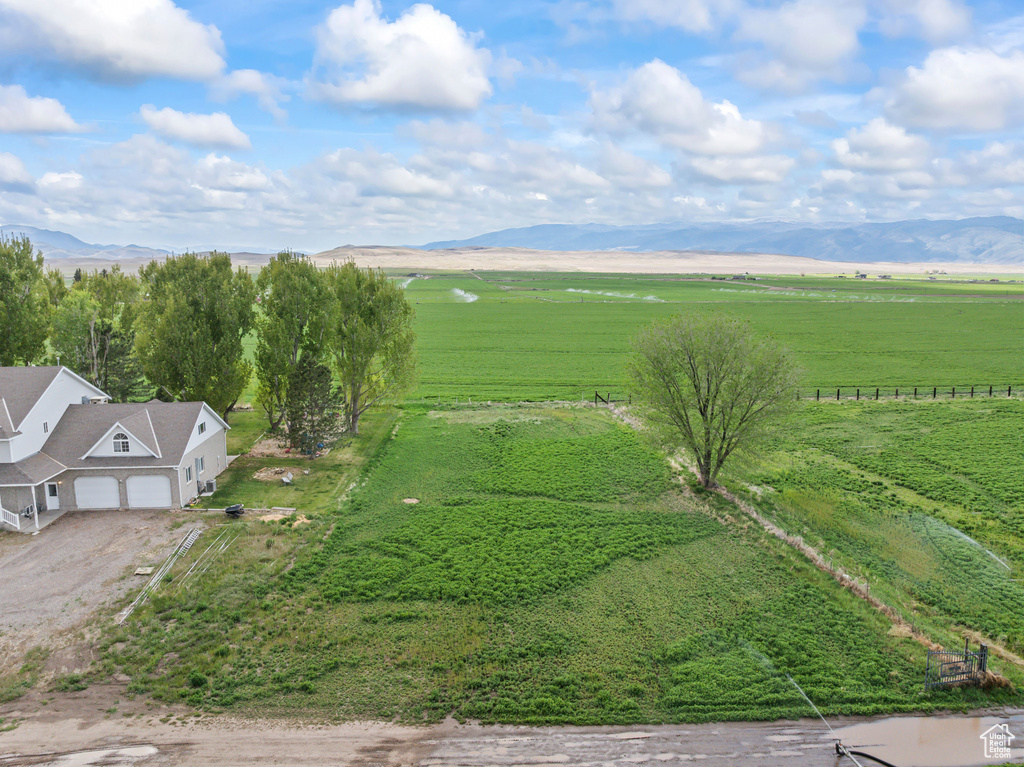 Aerial view of sparsely populated area featuring a mountainous background