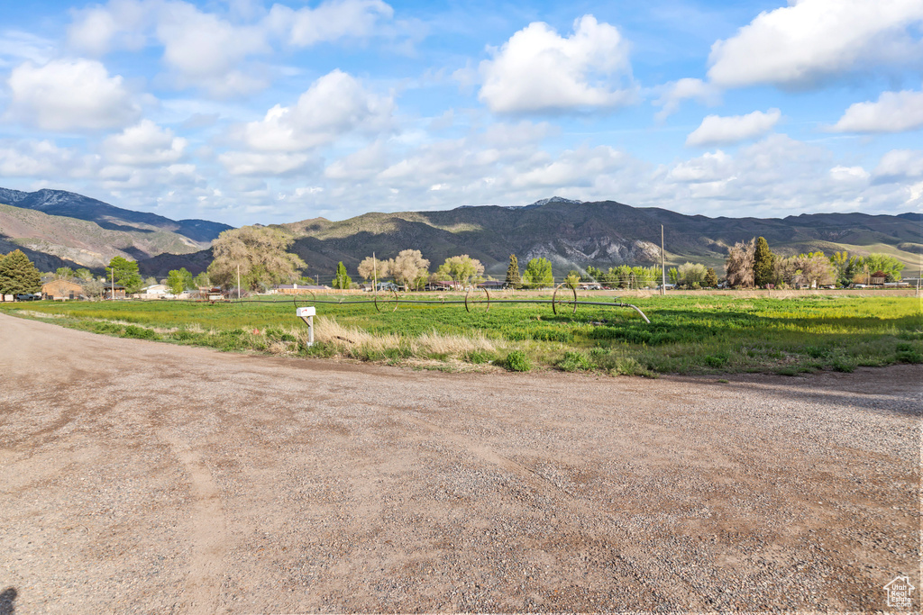 View of mountain backdrop featuring rural landscape