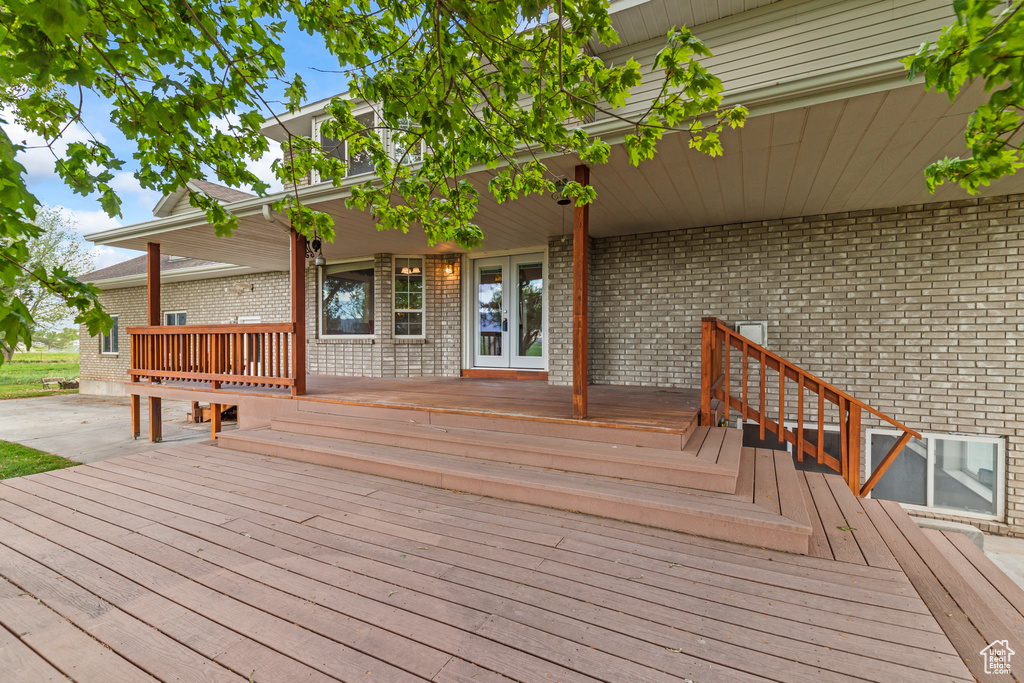 Wooden deck featuring french doors