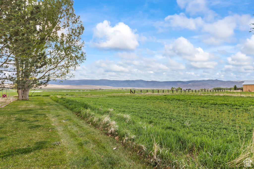 View of yard with a view of countryside and a mountain view