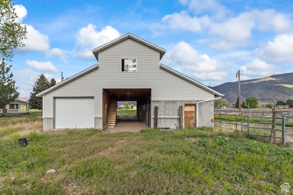 Garage with fence and a mountain view