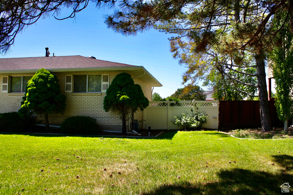 View of home\\\\\\\'s exterior featuring brick siding