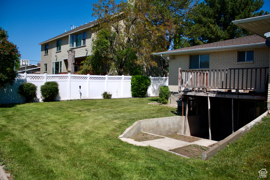 View of yard featuring a deck