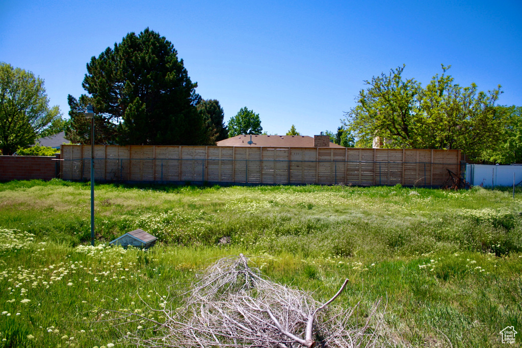 View of yard with fence