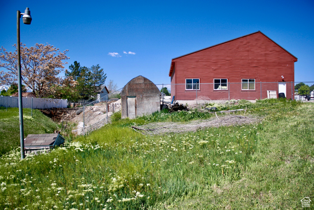 View of home\\\\\\\'s exterior with fence and an outbuilding