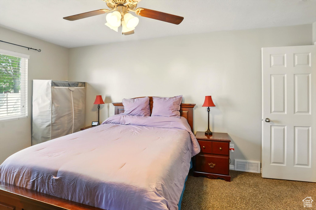 Bedroom featuring carpet floors and ceiling fan