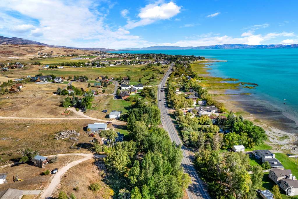 View of property location with a water and mountain view
