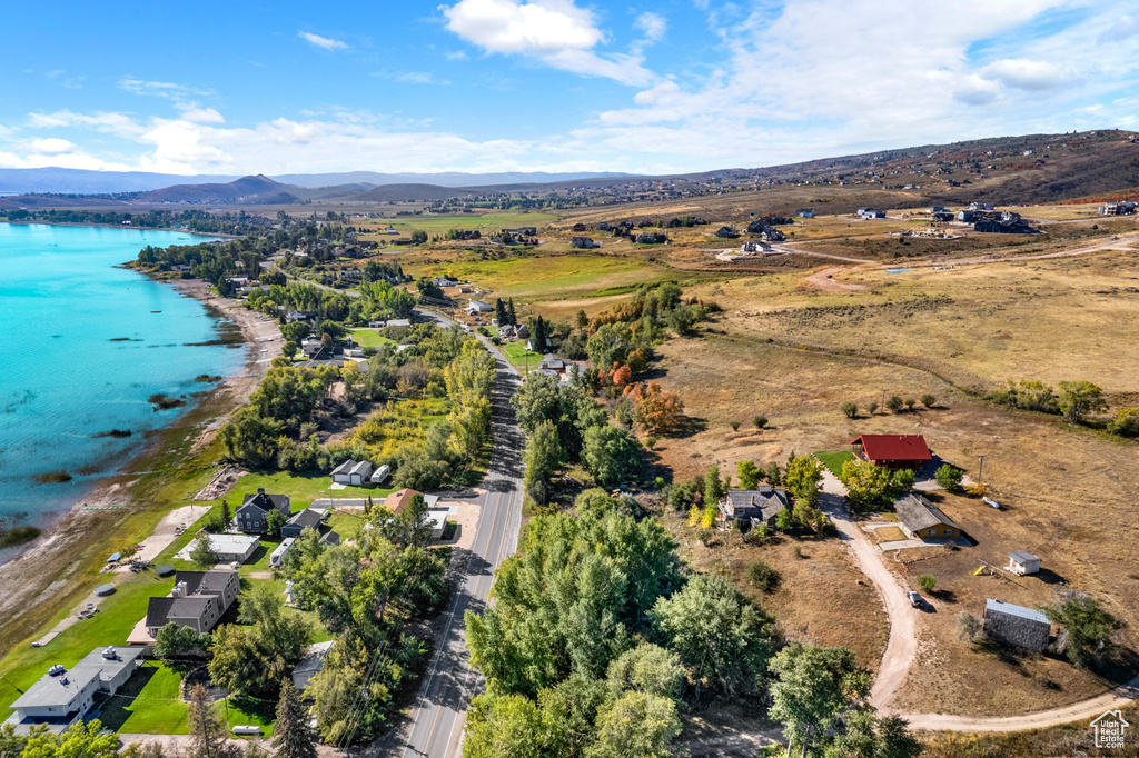 Aerial view of property's location with a water and mountain view