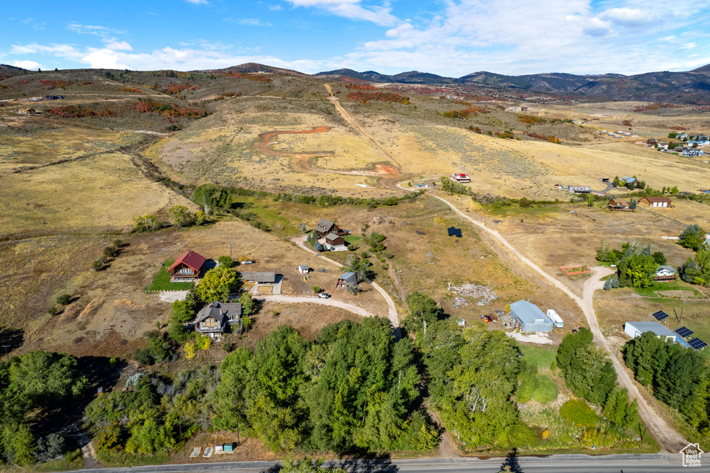 Aerial view of property's location featuring mountains