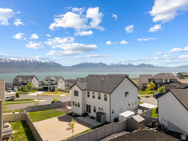 View of mountain backdrop featuring nearby suburban area