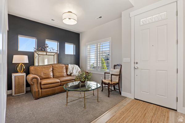 Living area featuring baseboards and wood finished floors