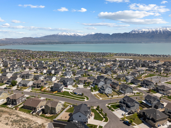 Aerial perspective of suburban area with a water and mountain view