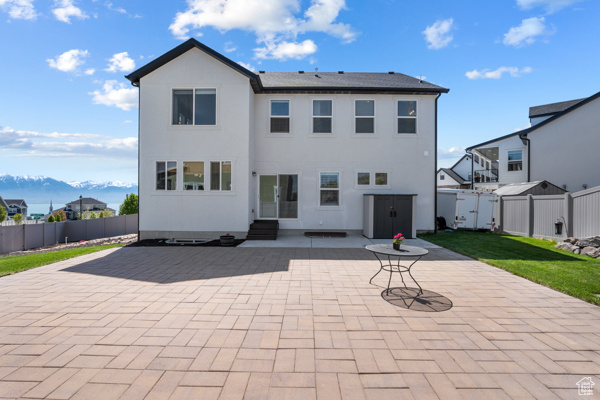 Back of property with a patio area and entry steps