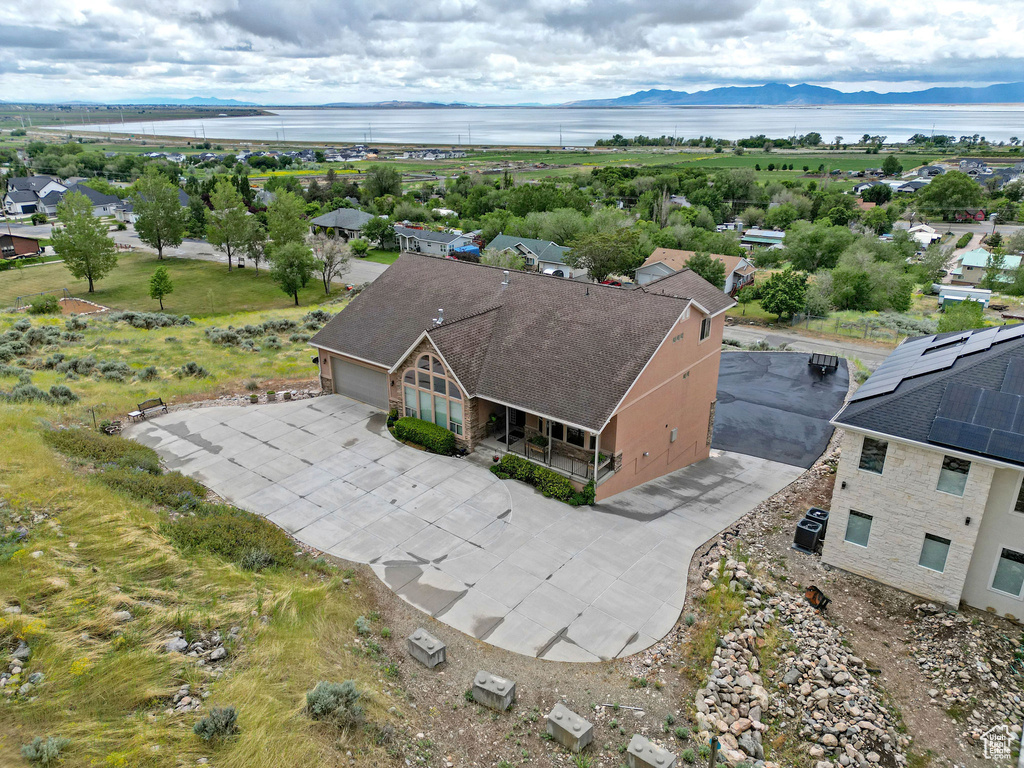 View of subject property featuring a water and mountain view